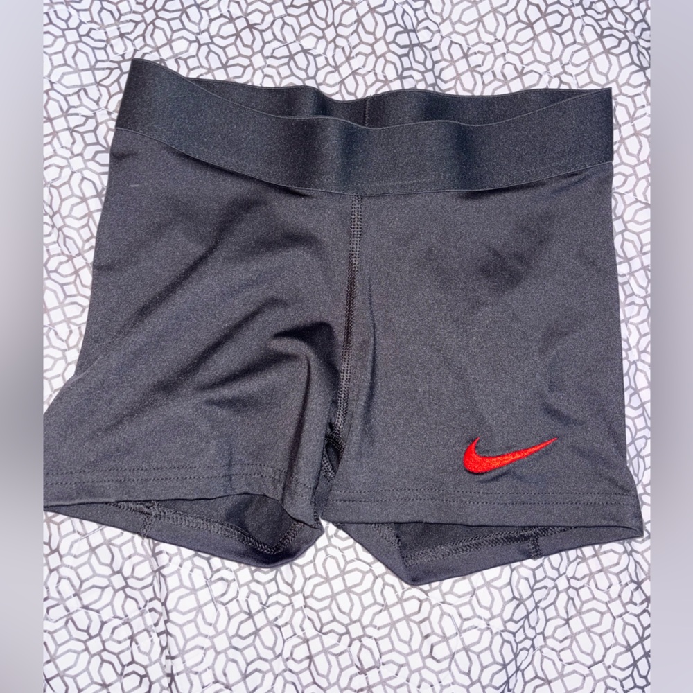 Nike Women's Black Athletic Shorts with Red Swoosh
